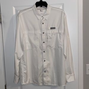 Size medium field and stream fishing shirt. Small ink stain on the left sleeve.